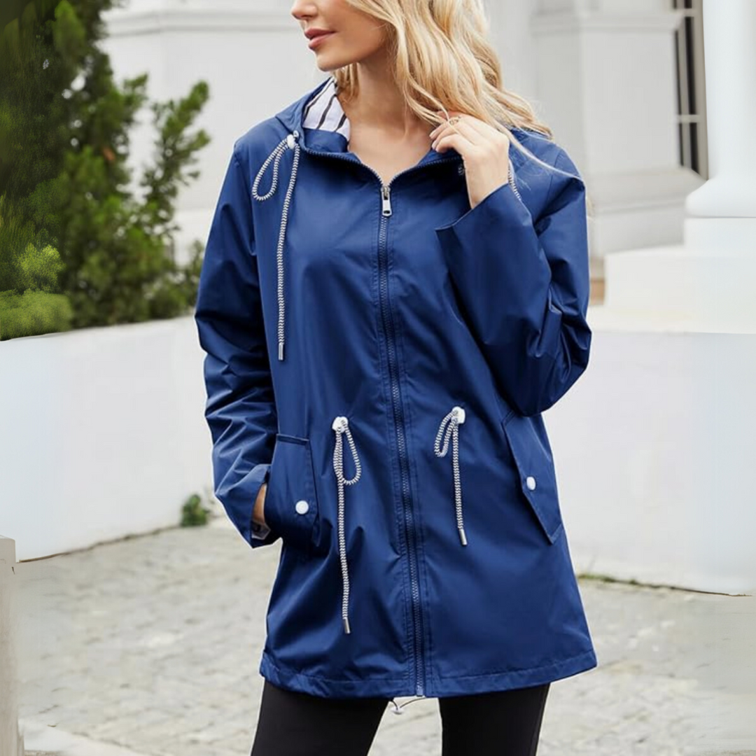 Modern women's travel rain jacket, lightweight & packable. Waterproof outerwear for reliable weather protection.