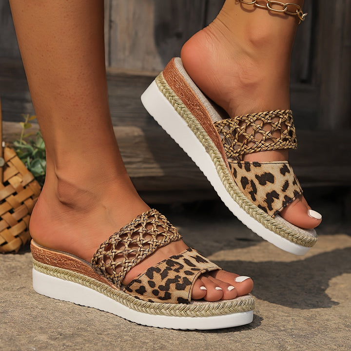 Vacation-ready women's woven wedge sandals, combining style & comfort.