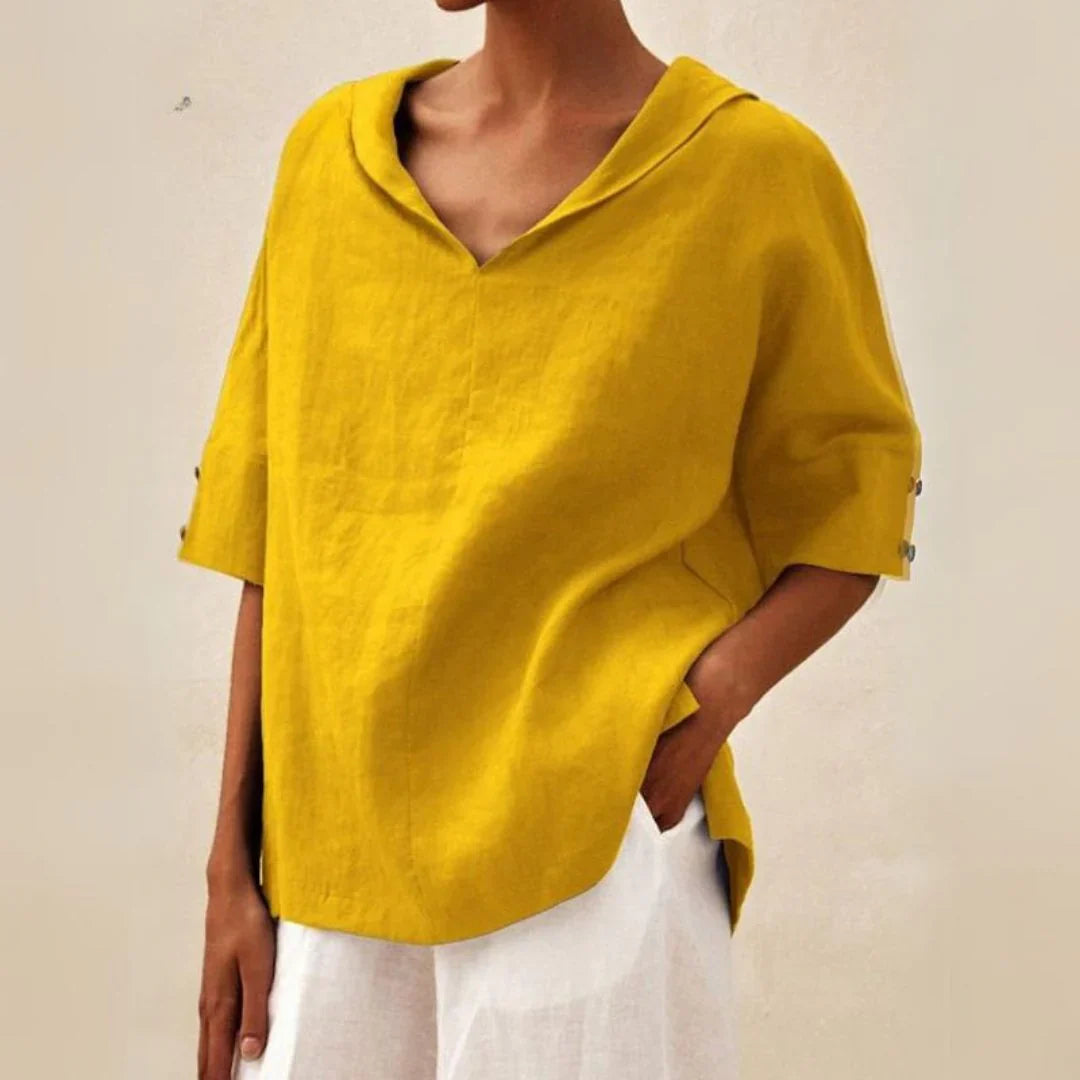 Women's button-front summer shirt shown with sleeves rolled up, offering a chic and relaxed casual wear look.