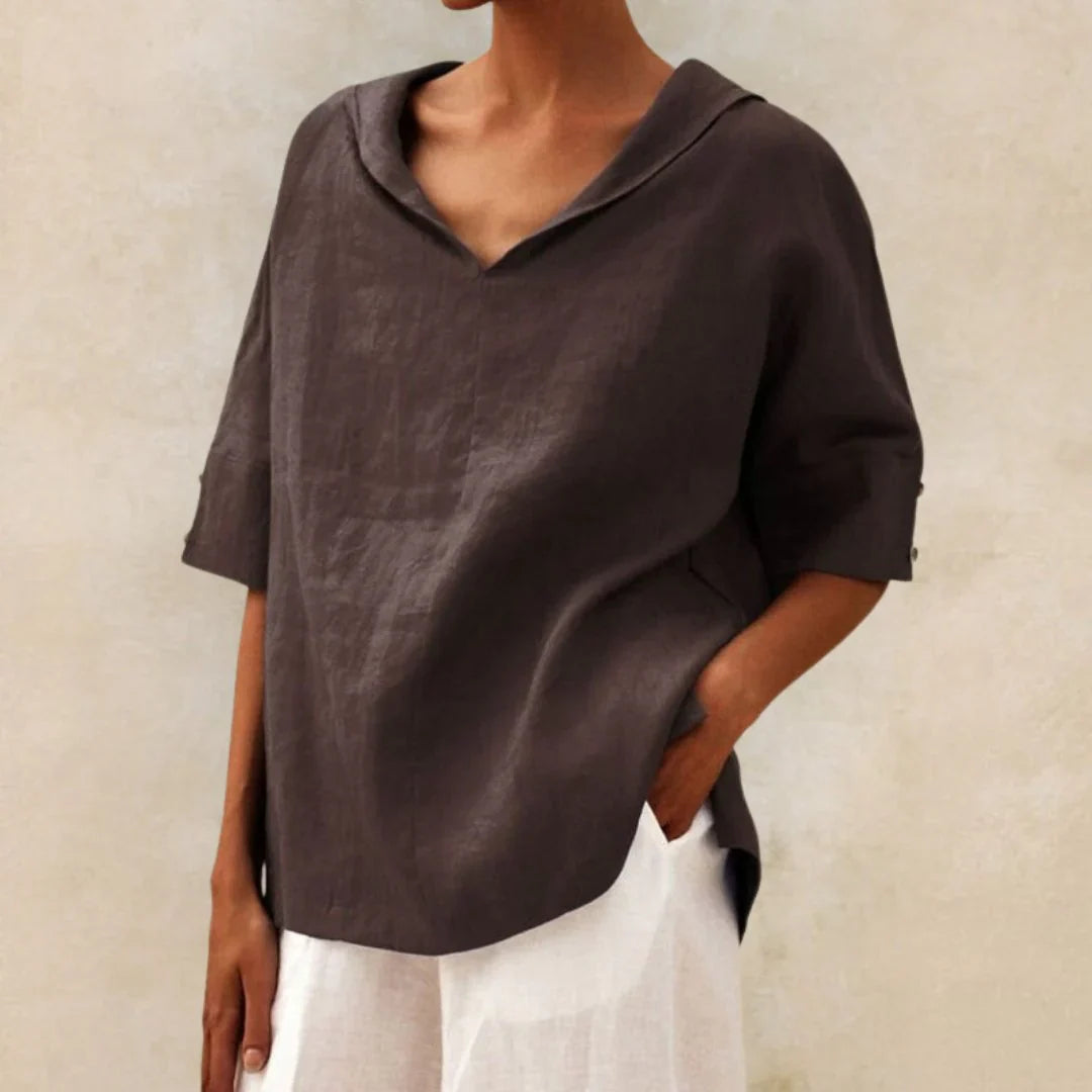 Relaxed fit ladies shirt for summer. Features a stylish button front & roll-up sleeves, ensuring comfort & versatility.