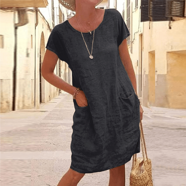 Women's summer midi dress with short sleeves & practical pockets. Ideal for casual everyday wear and warm weather.
