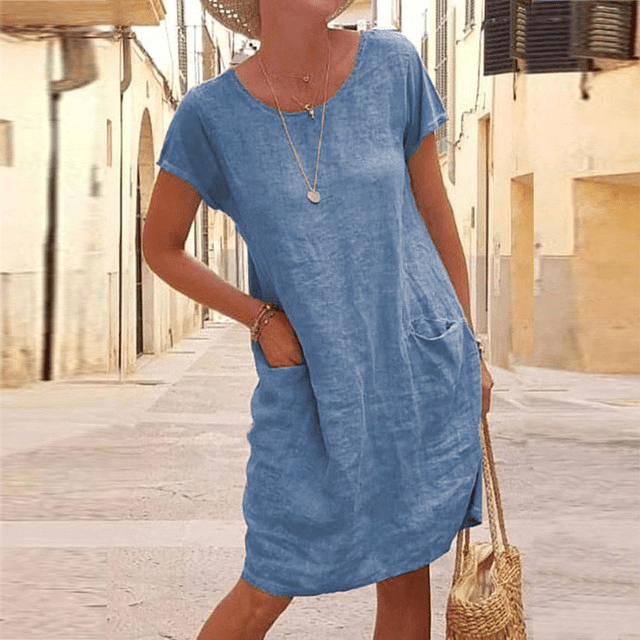 Chic women's relaxed-fit midi dress with short sleeves & pockets. Comfortable and versatile for summer everyday style.