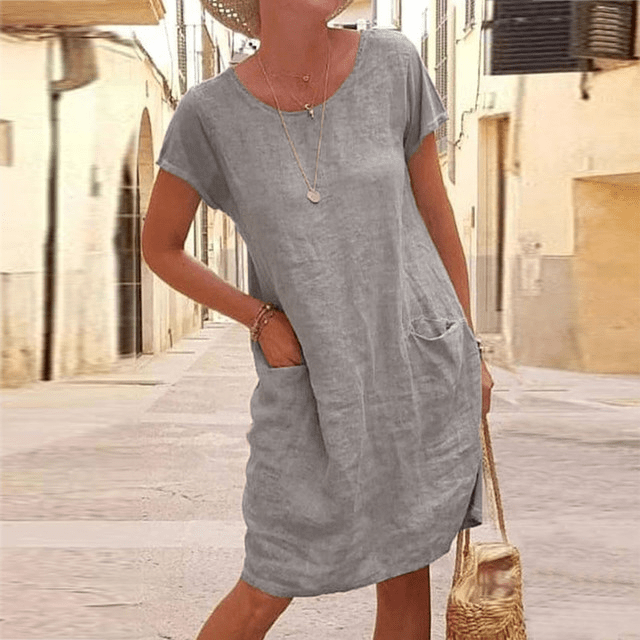 Versatile women's short-sleeve midi dress with functional pockets. Perfect for summer casual, everyday wear, and chic style.