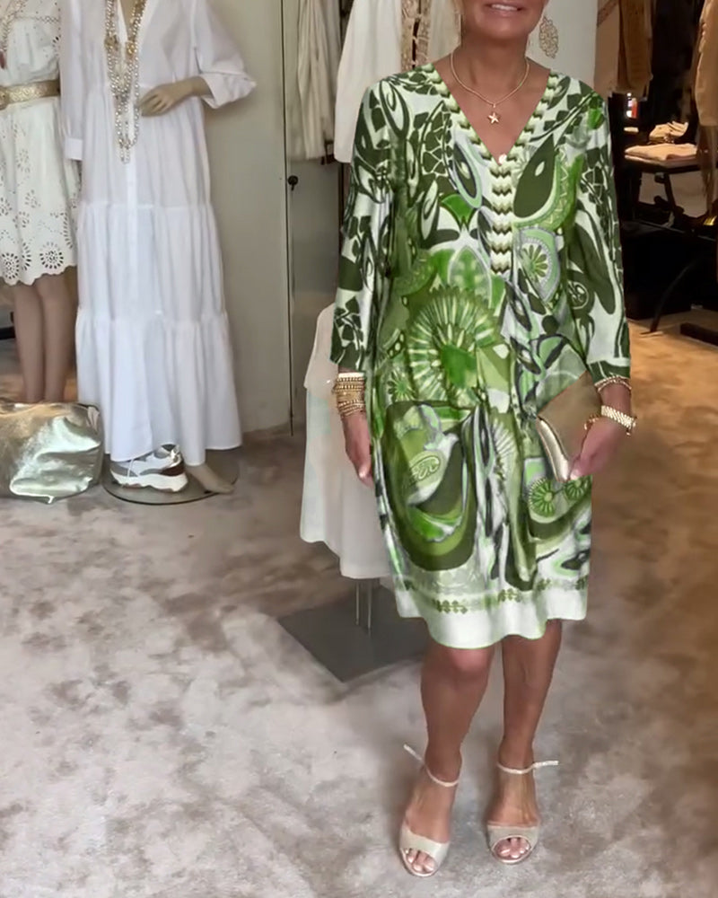 Back view of a comfortable women's sunburst print boho tunic dress, great for resort wear.