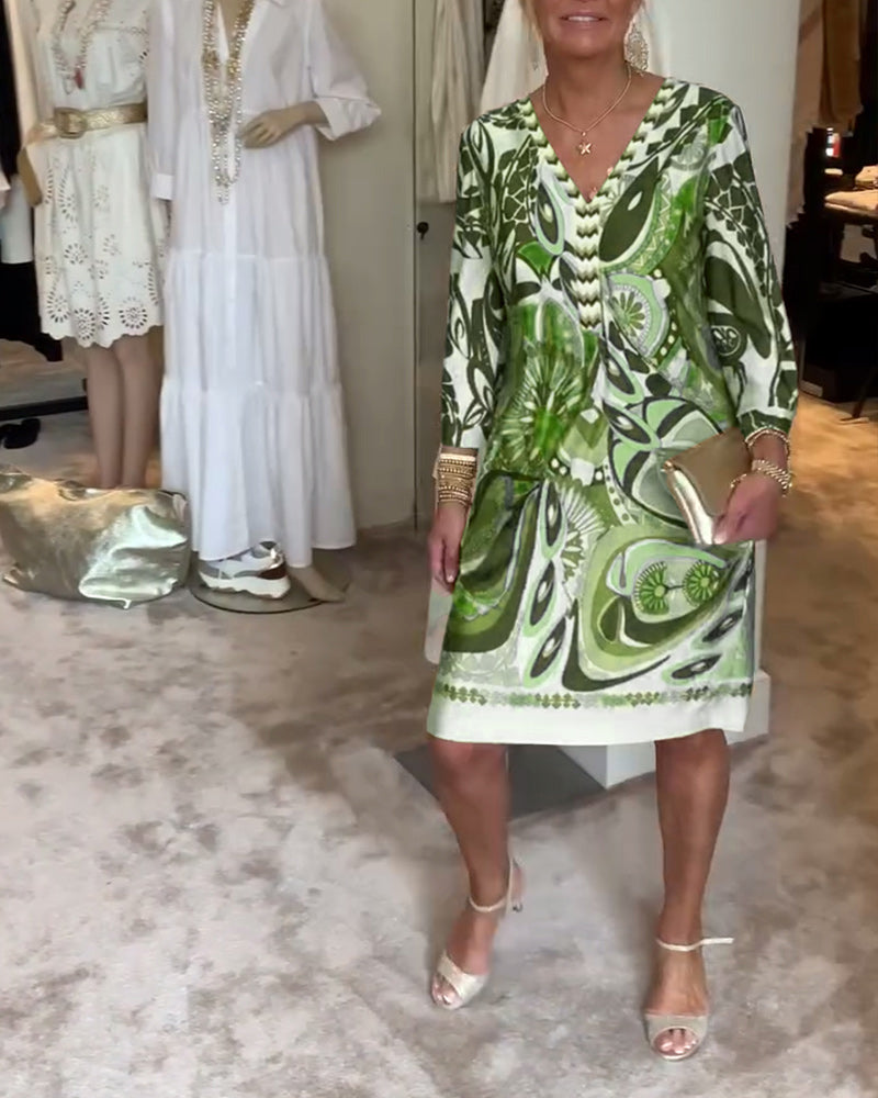 Side view of a stylish women's sunburst print tunic dress, perfect for casual summer wear.