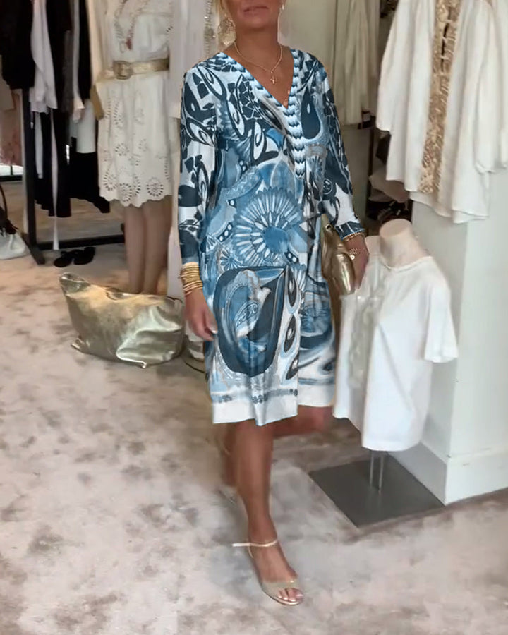 Eye-catching sunburst print women's boho tunic dress, perfect for stylish summer vacation outfits.