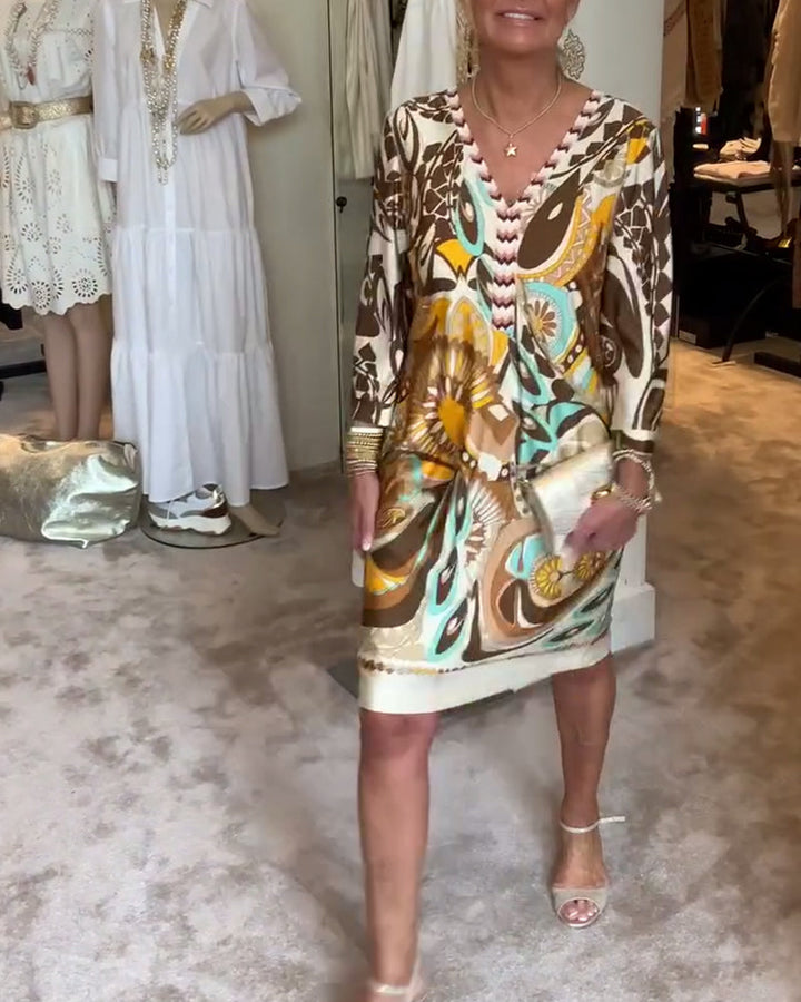 Stylish women's vibrant sunburst print boho tunic dress, perfect for summer.