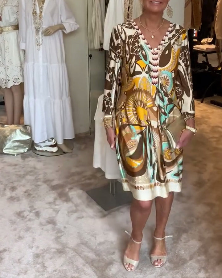 Comfortable & stylish women's boho tunic dress with vibrant sunburst print.