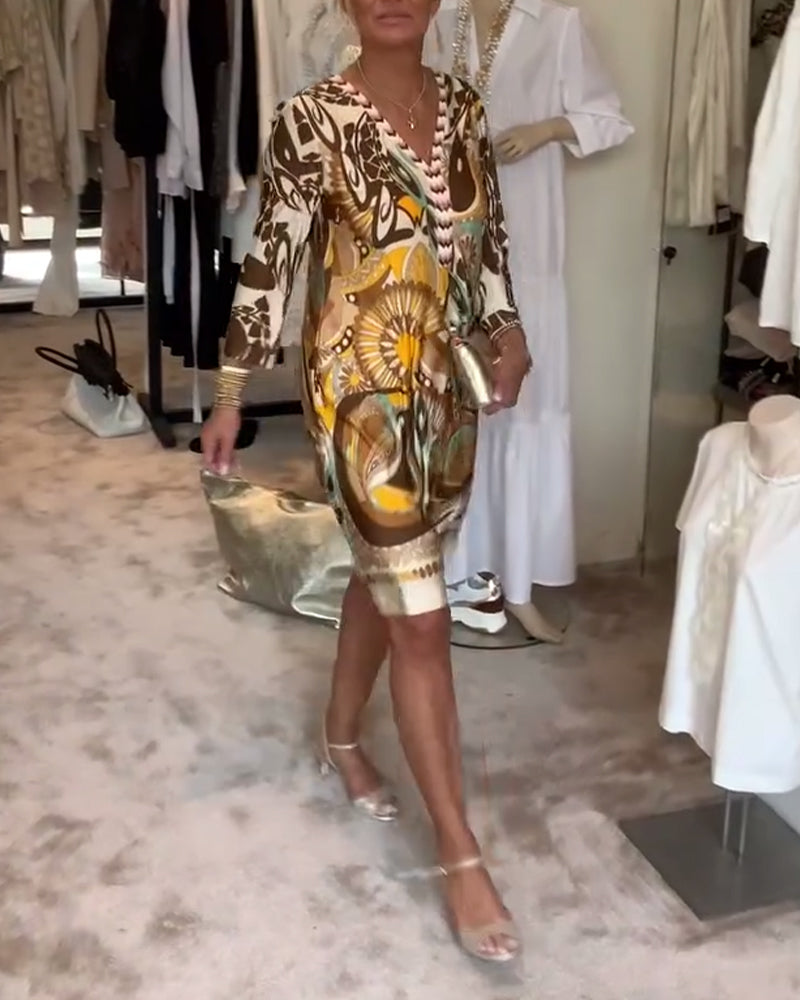 Full length view of a women's sunburst print boho tunic dress, ideal for summer outfits.