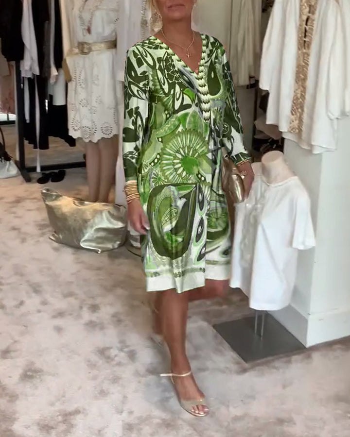 Front view of a women's vibrant sunburst print casual tunic dress, ideal for summer days.