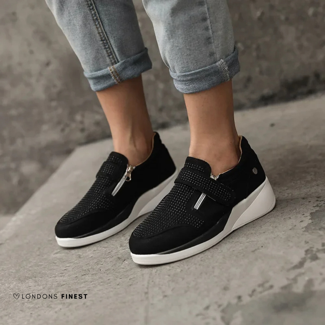 Supportive women's comfort sneakers, designed for daily wear with cushioned arch support and adjustable fit.