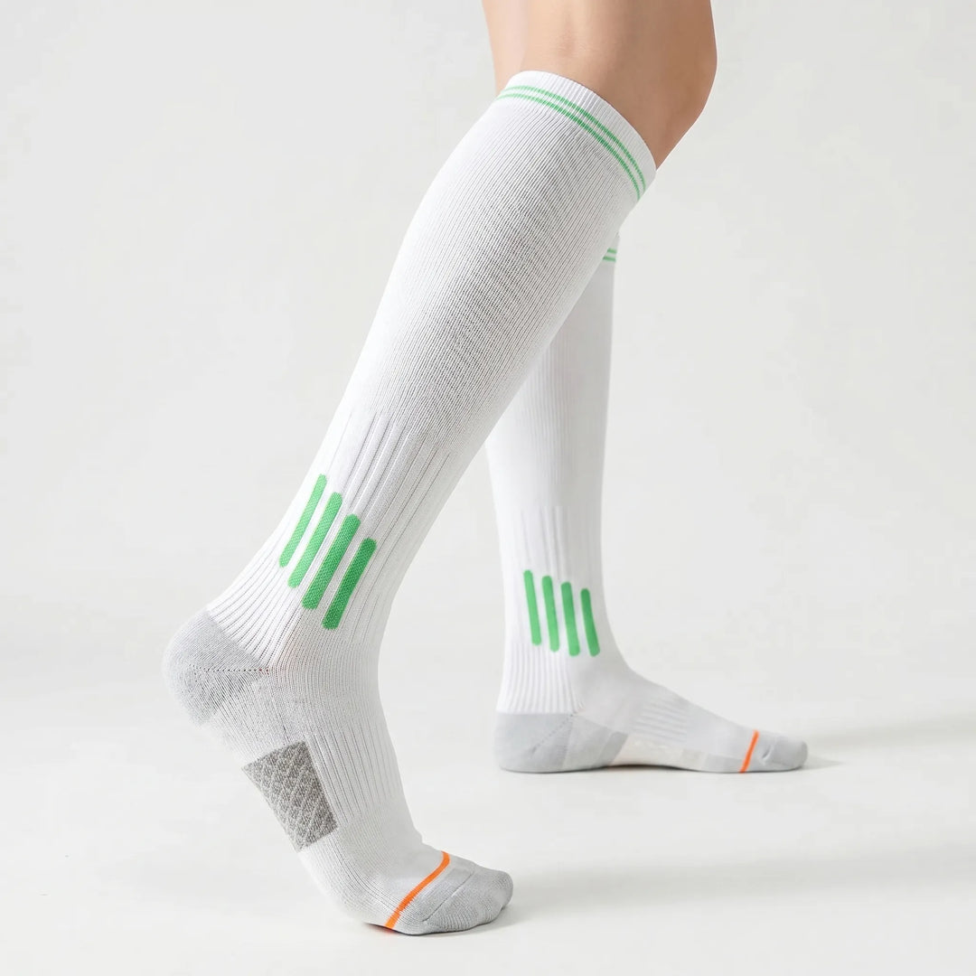 Knee-high women's sports socks offering support for active workouts & training.