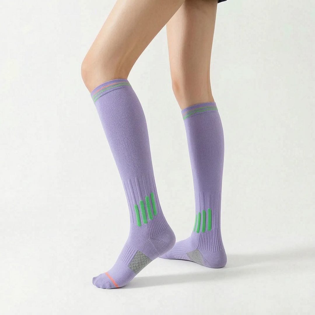 Supportive knee-high women's athletic socks to enhance active sports performance.