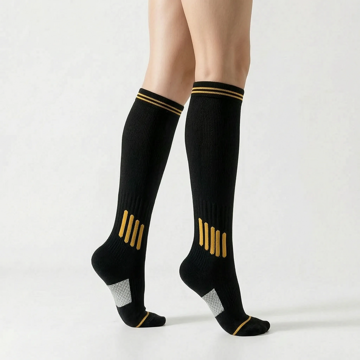 Women's knee-high sports socks with support for active training and workouts.