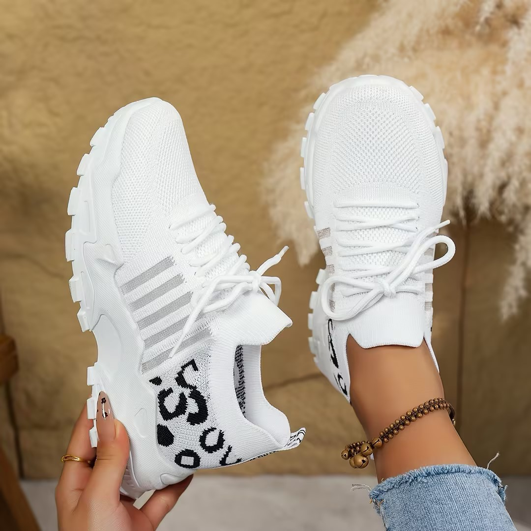 Women's athletic lace-up walking sneakers, offering orthopedic support and cushioned comfort.