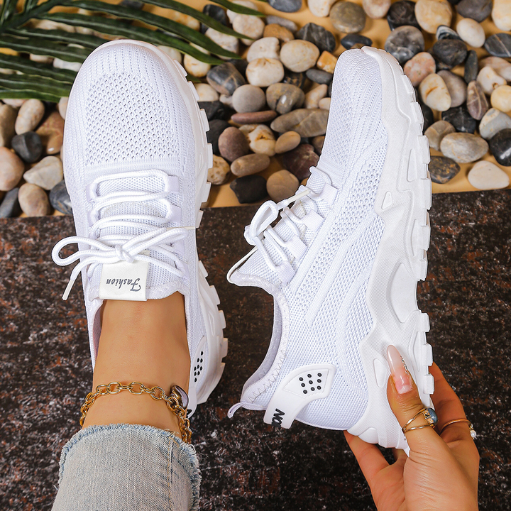 Cushioned women's orthopedic walking sneakers, lace-up style for supportive and comfortable footwear.