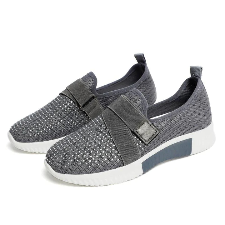 Supportive women's athletic style slip-on shoes offering posture support and stability.