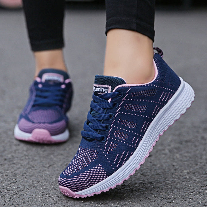 Active women's walking shoes, featuring breathable material & supportive design for comfort.