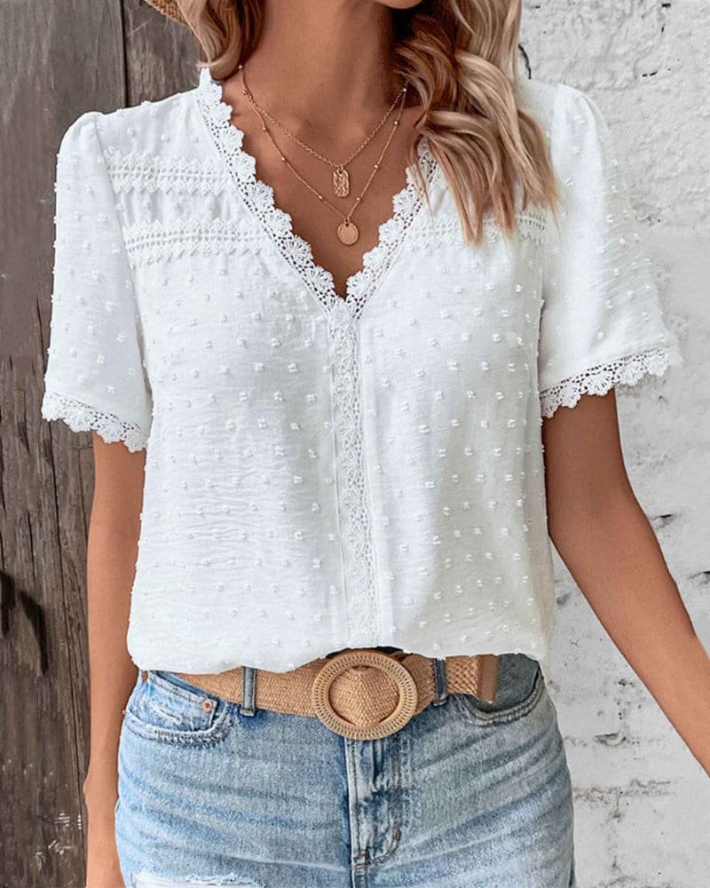 Women's Swiss Dot V-Neck Top with delicate lace trim. Perfect for spring and summer casual wear.