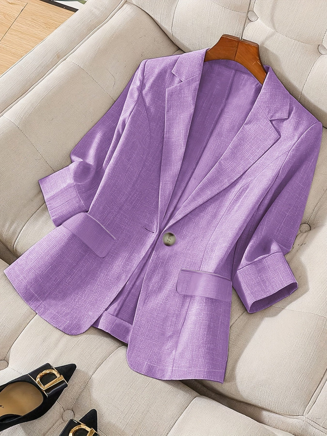 Women's tailored black cropped blazer, front view. Perfect for business casual & office wear.