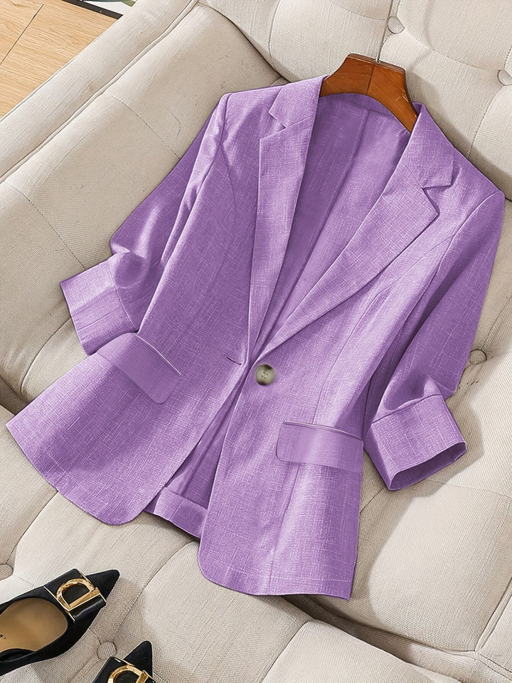 Women's tailored black cropped blazer, front view. Perfect for business casual & office wear.