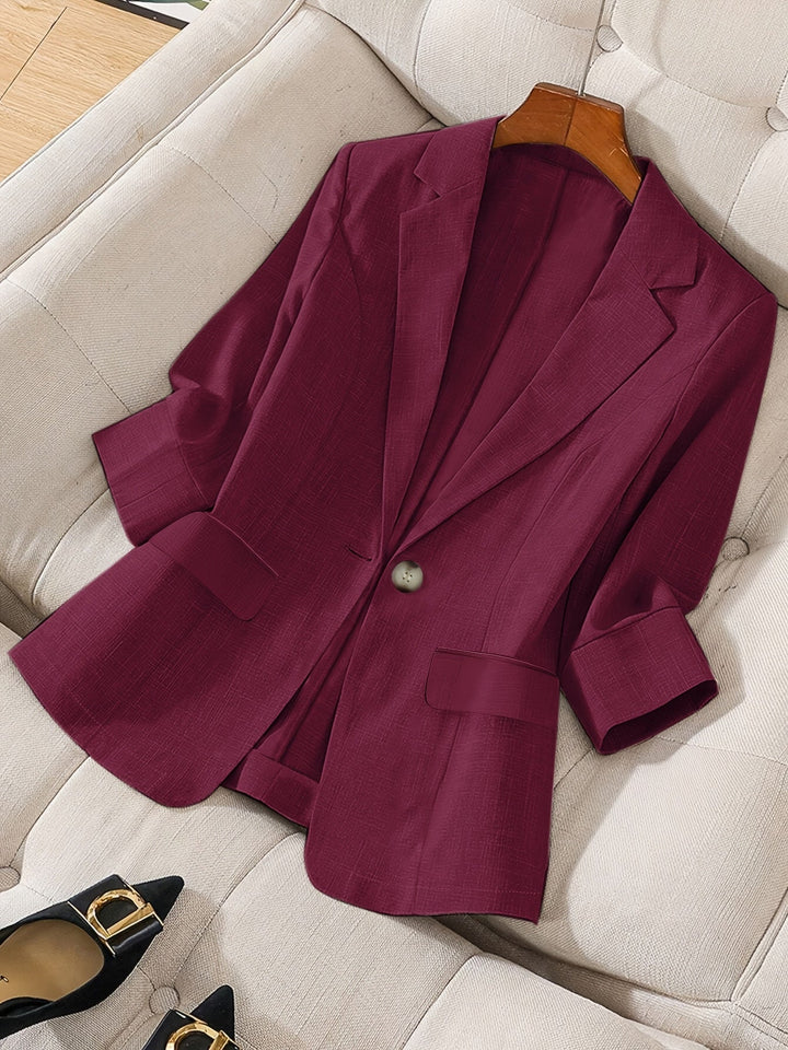 Chic women's tailored cropped blazer in a rich color, front angled view for modern style.