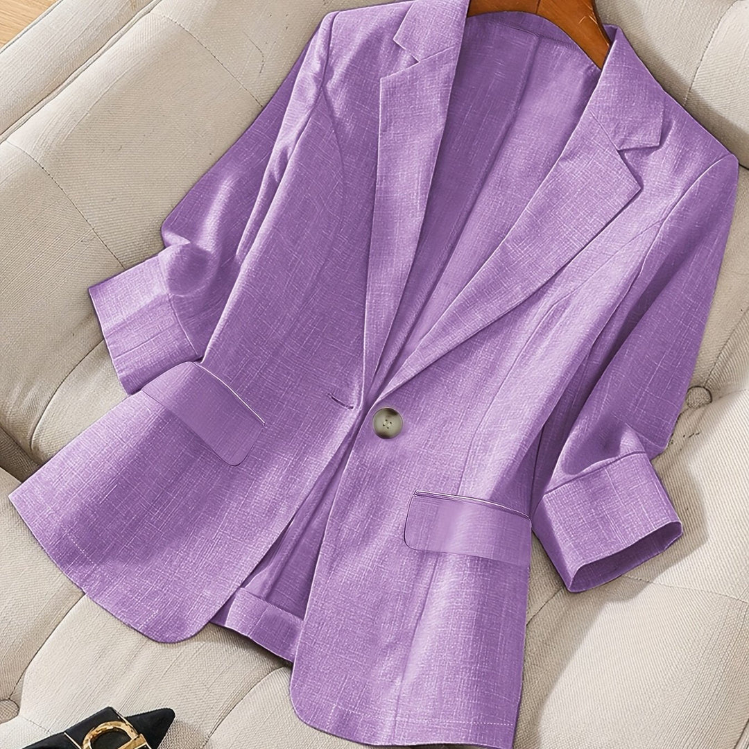 Functional pocket detail on the modern women's tailored cropped blazer, practical & chic.