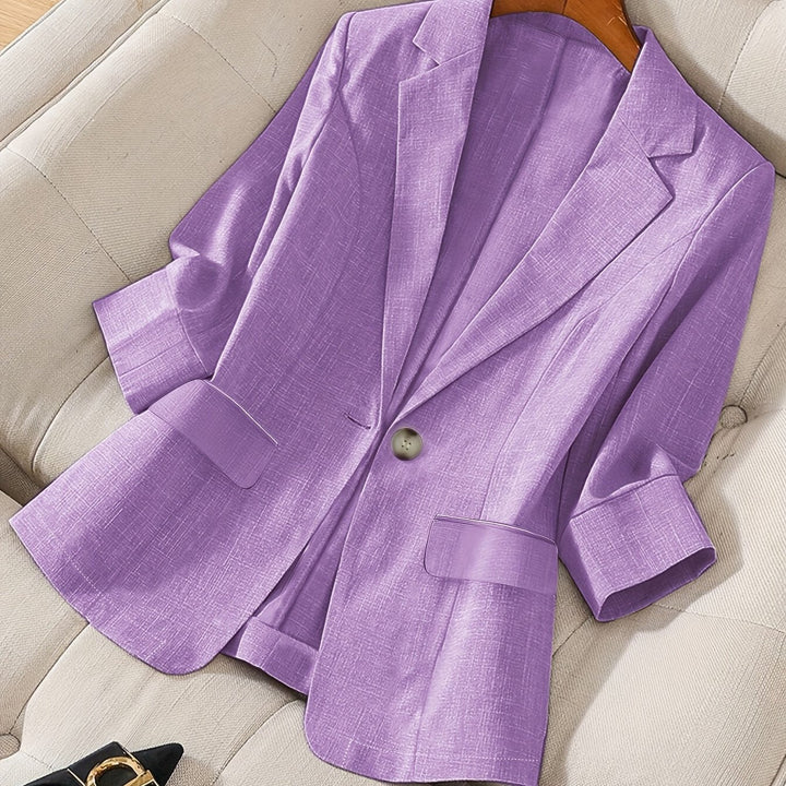 Functional pocket detail on the modern women's tailored cropped blazer, practical & chic.
