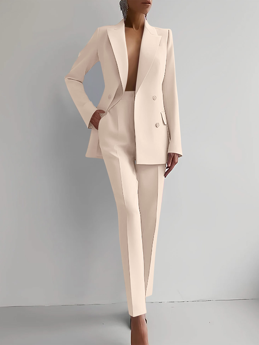 Sophisticated women's professional double-breasted suit with a chic tailored blazer and comfortable slim trousers.