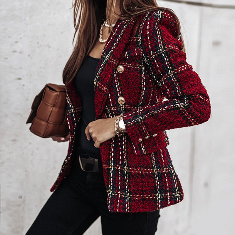 Detailed view of a women's double-breasted tailored blazer, highlighting classic gold buttons and structured fit.