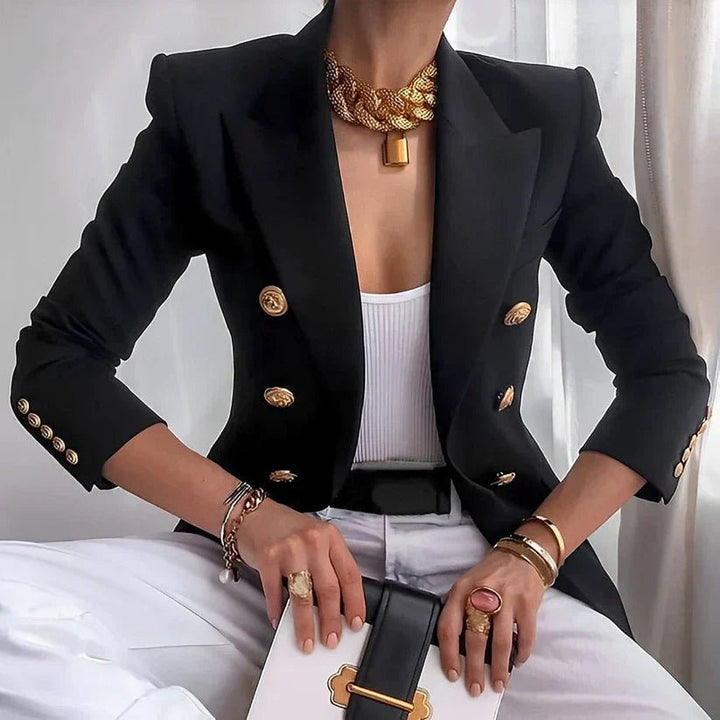 Women's tailored double-breasted blazer with shining gold buttons, perfect for professional office wear.