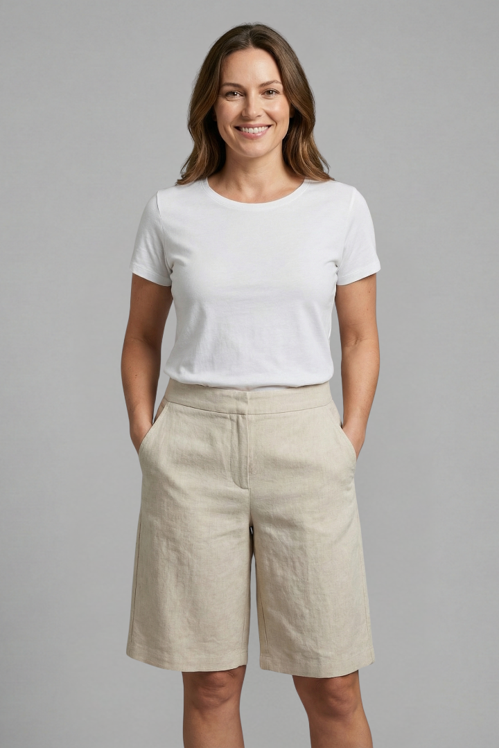 Comfortable women's tailored flat front shorts, knee-length. Versatile casual chic for everyday summer wear.