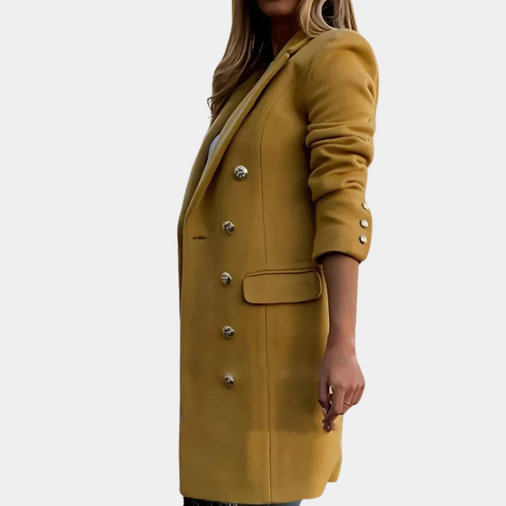 Stylish women's long trench coat, tailored with button closure for an elegant and versatile autumn/spring look.