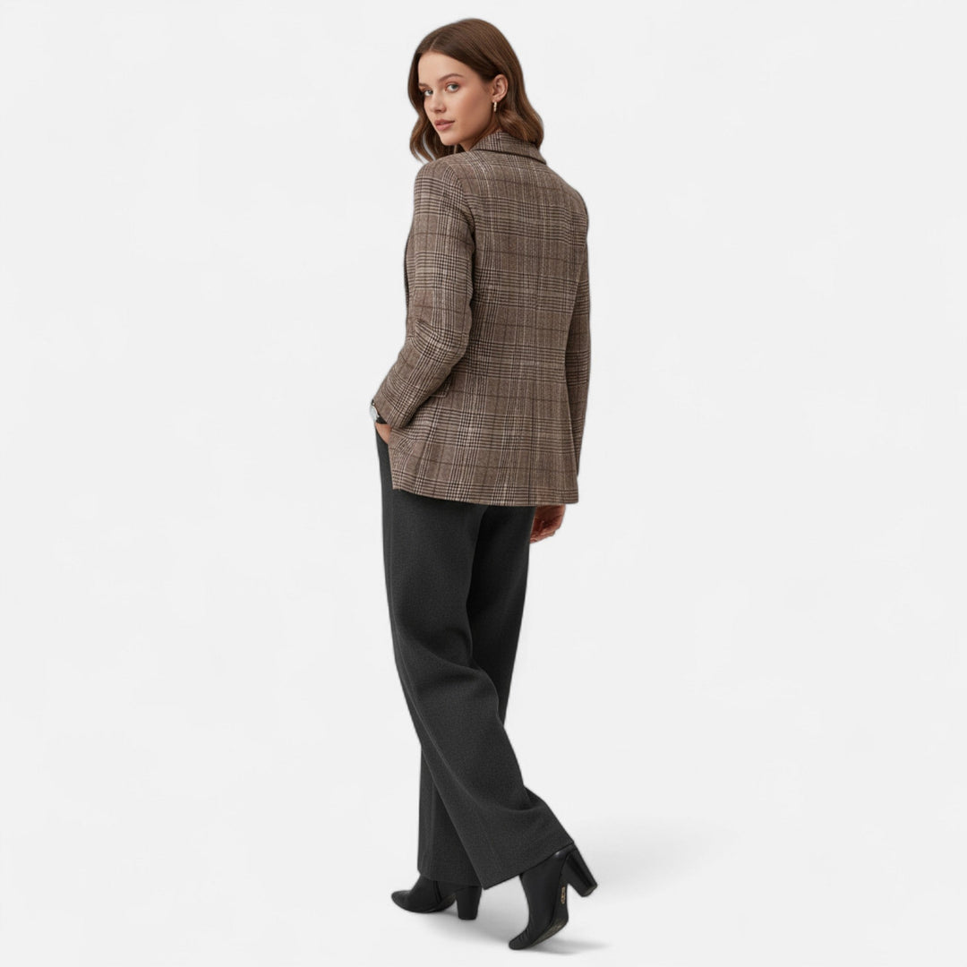 Chic women's tailored plaid blazer. Versatile for smart casual, office, or evening fashion. Modern outerwear.