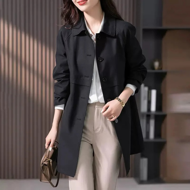 Versatile women's single button trench coat. Tailored fit for both casual jackets and sophisticated office attire.