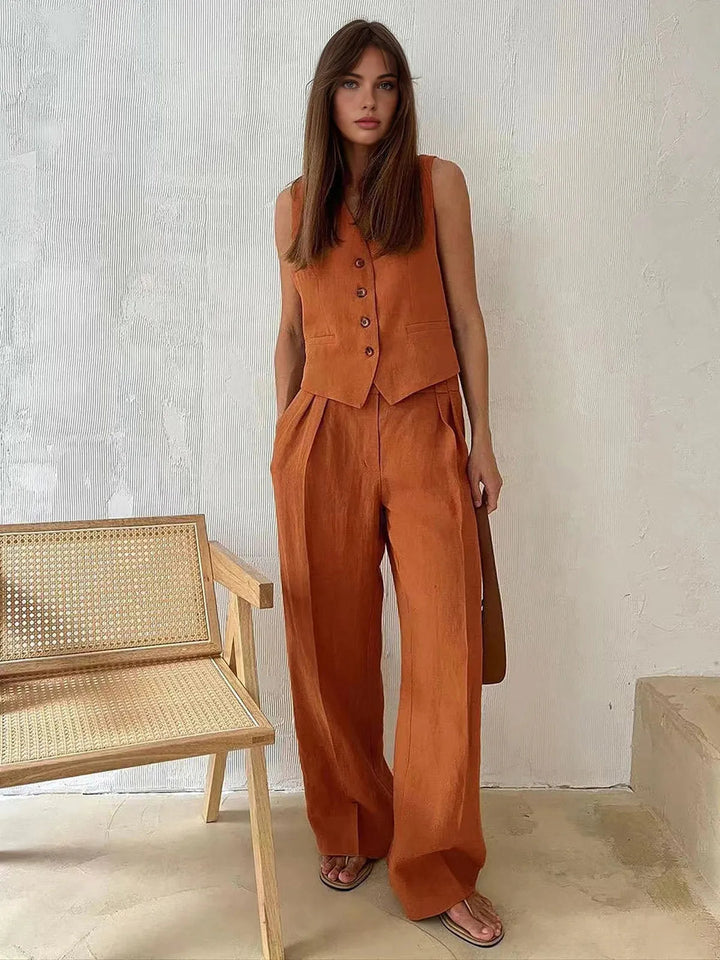 Elegant women's two-piece set featuring a tailored waistcoat & wide leg trousers. Ideal for summer office wear & chic events.
