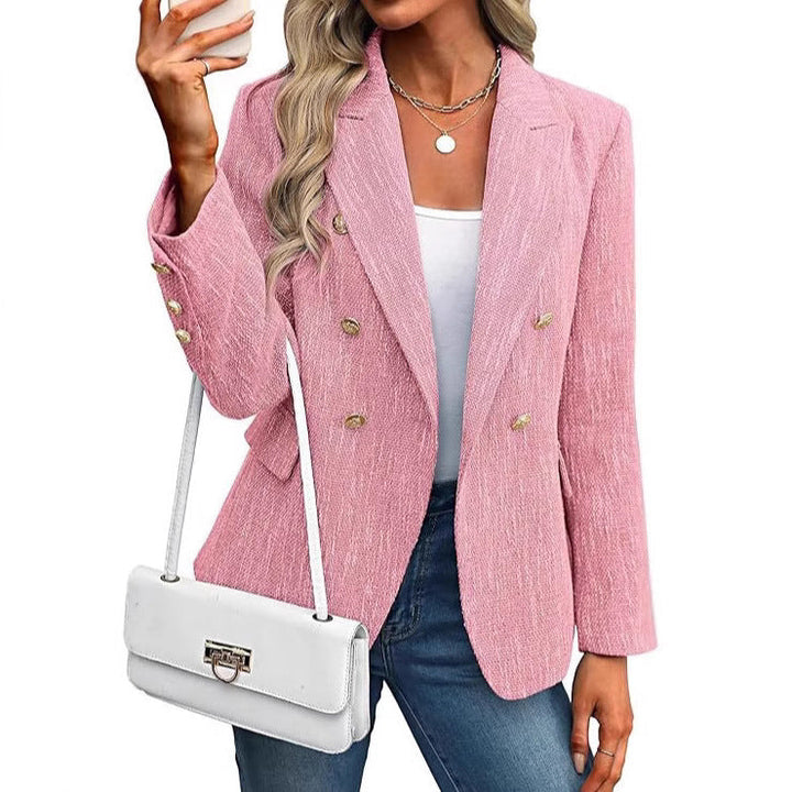 Elegant women's double-breasted office blazer with a refined texture and luxurious gold button accents.