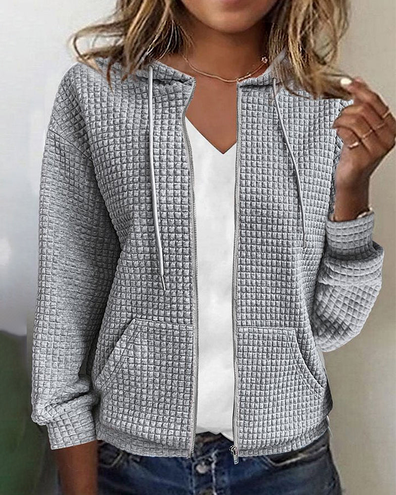 Women's textured zip-up hoodie jacket with front pockets. Ideal for casual layering & everyday comfort.