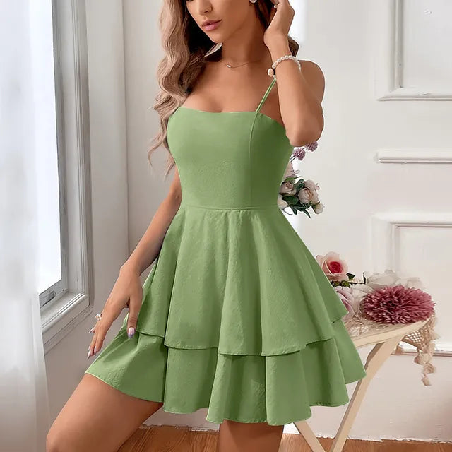 Chic women's tiered A-line mini dress for homecoming, with adjustable spaghetti straps & a playful ruffled hem.