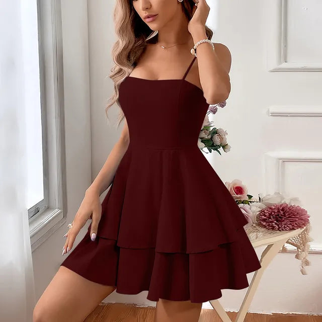 Elegant women's short A-line party dress, a tiered ruffled design with slender spaghetti straps, ideal for events.