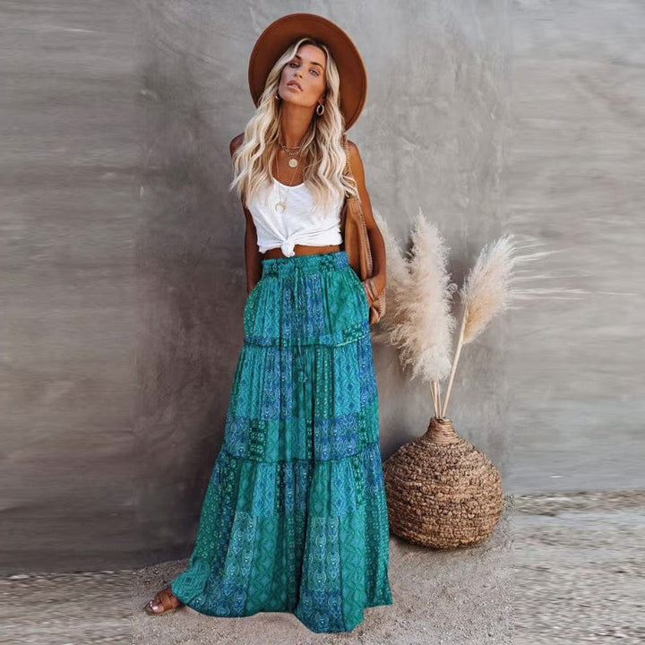 Flowy women's floral tiered maxi skirt with comfortable elastic high waist, great for summer casual.