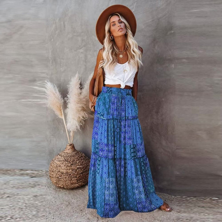 Bohemian women's floral tiered maxi skirt, high elastic waist, summer vacation and beach attire.