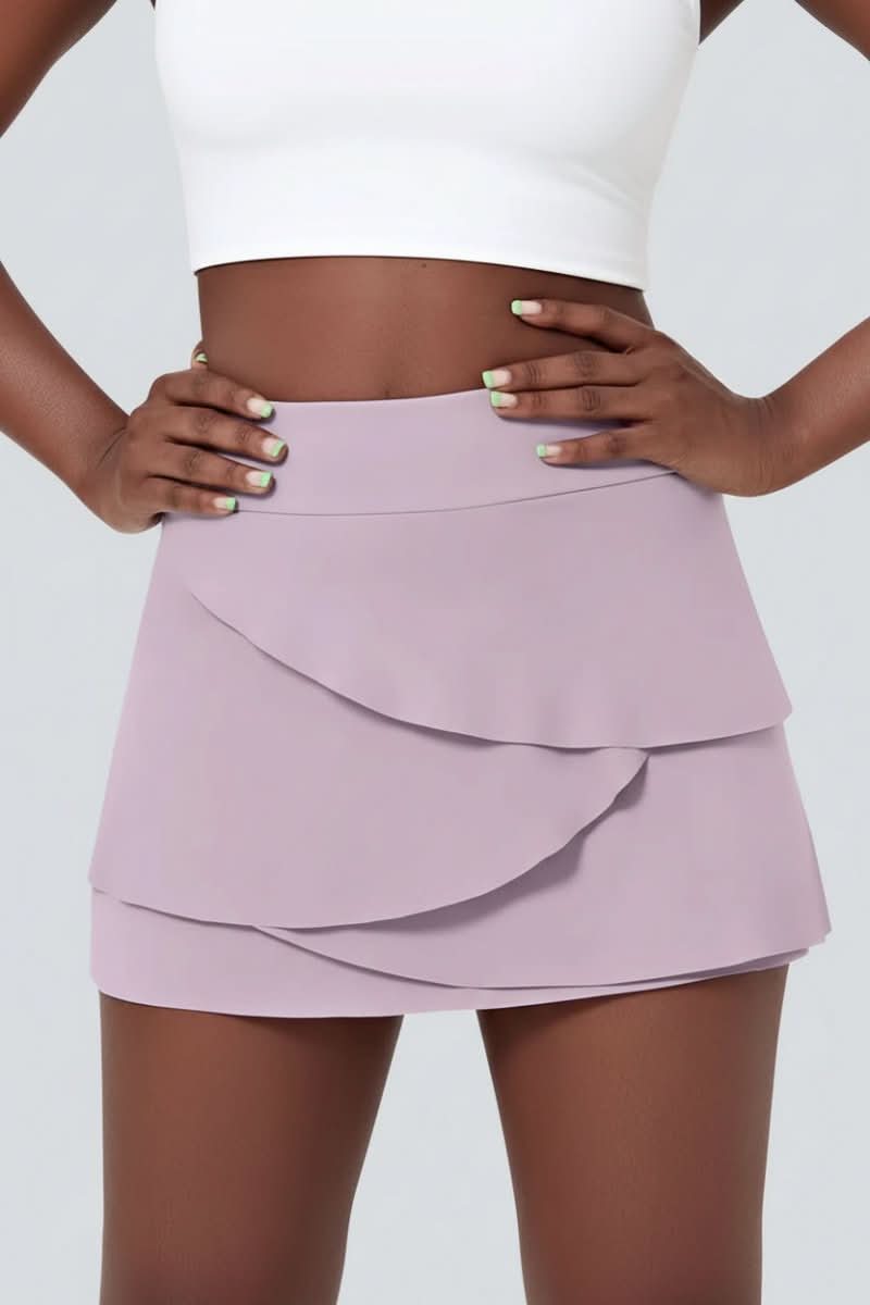Stylish women's tiered golf skort, perfect for athleisure & active play, featuring convenient side pockets.