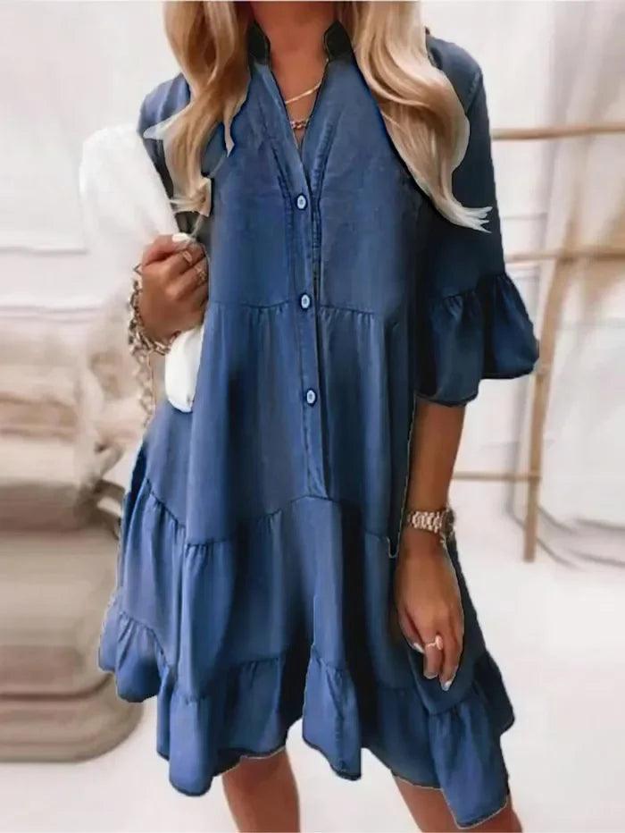 Relaxed fit women's mini dress, adorned with tiered ruffles and a classic button-down front. Summer style.
