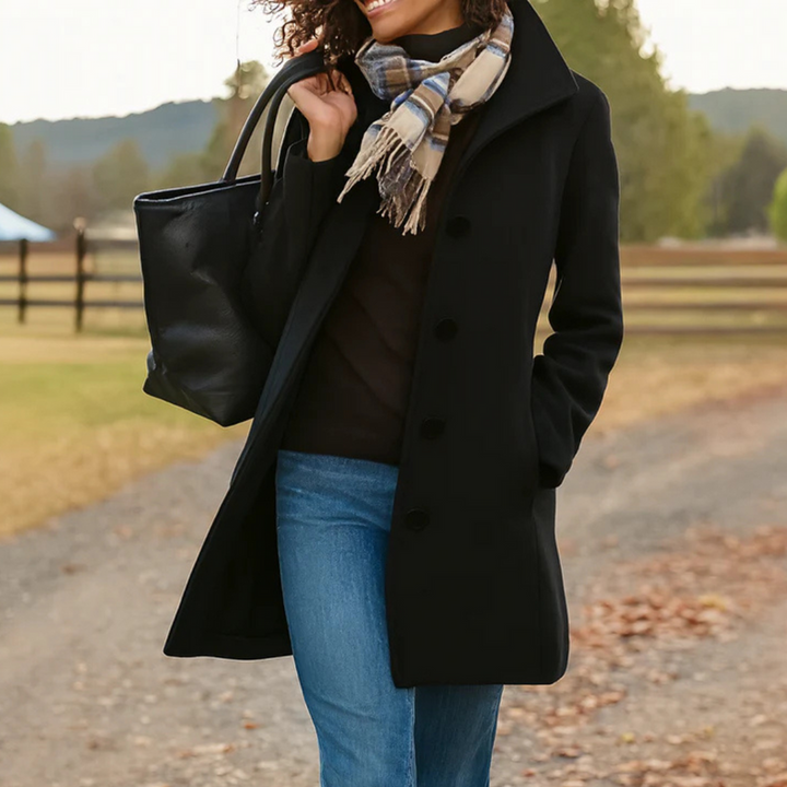 Women's long sleeve button-up coat, offering timeless style. Elegant fall/winter outerwear for any occasion.