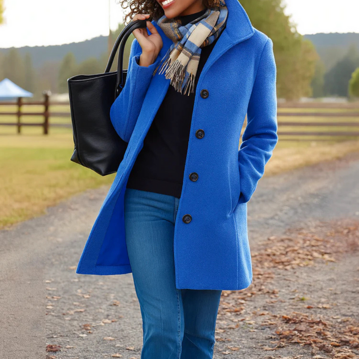 Elegant women's button-up coat. Long sleeve outerwear for sophisticated fall and winter workwear.