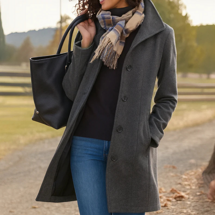 Sophisticated women's button-up coat for fall/winter. Timeless elegance, perfect for versatile layering.