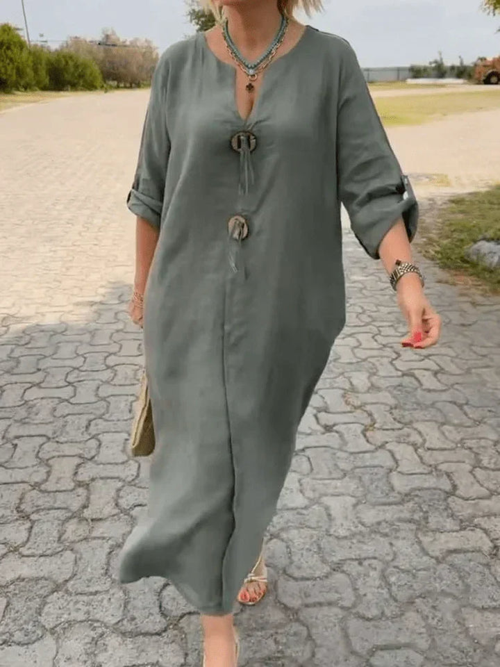 Comfortable women's timeless tunic dress, chic design. Adjustable sleeves make it perfect for summer elegance.