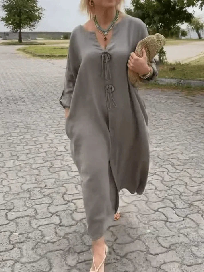Women's relaxed fit tunic dress, with stylish adjustable sleeves. Perfect for chic casual & elegant everyday wear.
