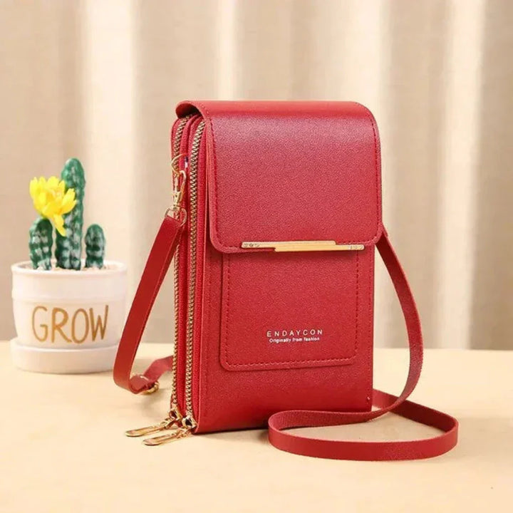 Compact women's touch screen phone crossbody bag, ideal for travel, keeping your phone secure & accessible.